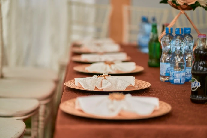 A table is set with plates and napkins.